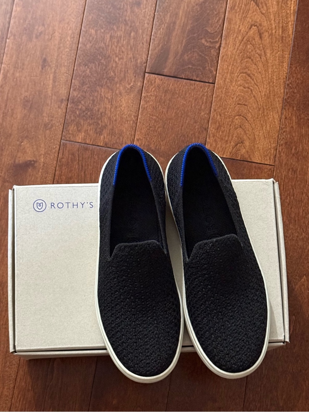 Rothy's Black Knit Slip-On Sneakers with Blue Trim